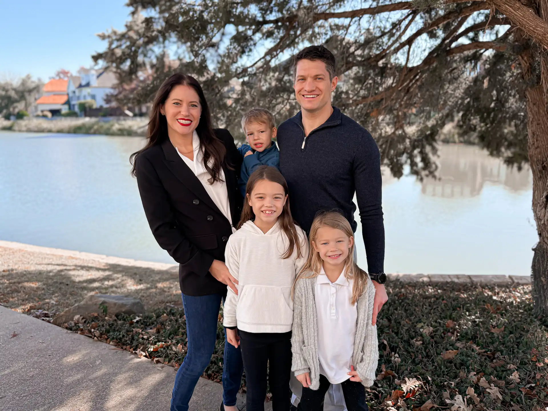 A family enjoying the lake trail at The Lakes